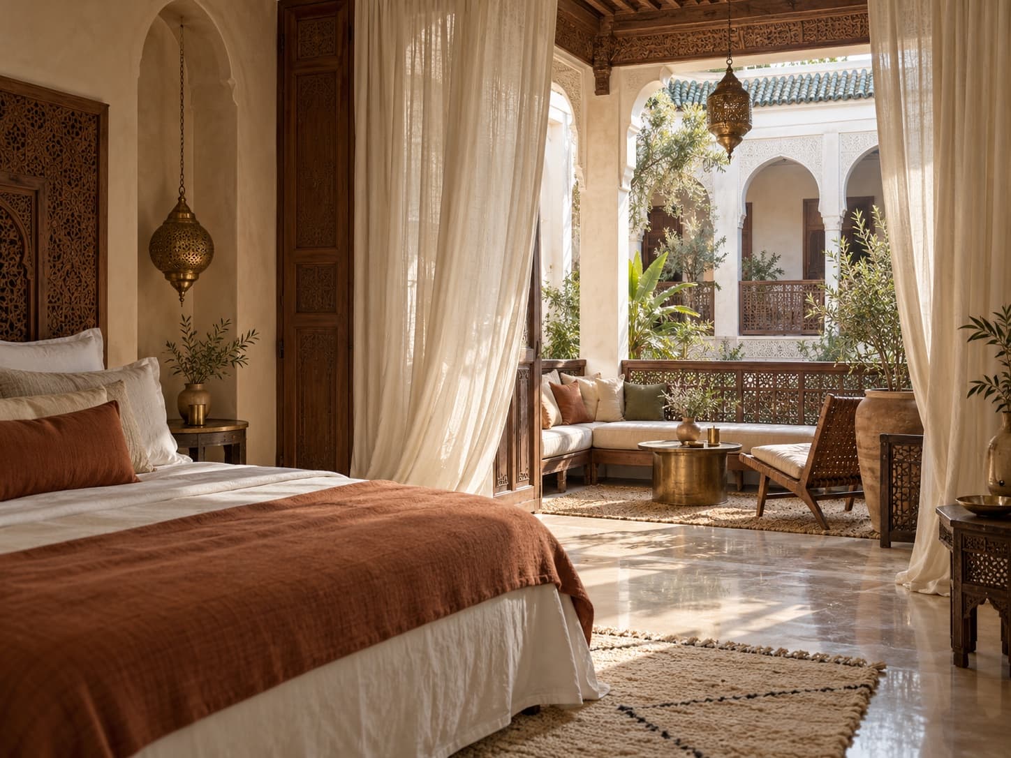 Bedroom with flowing curtains opening onto the courtyard balcony