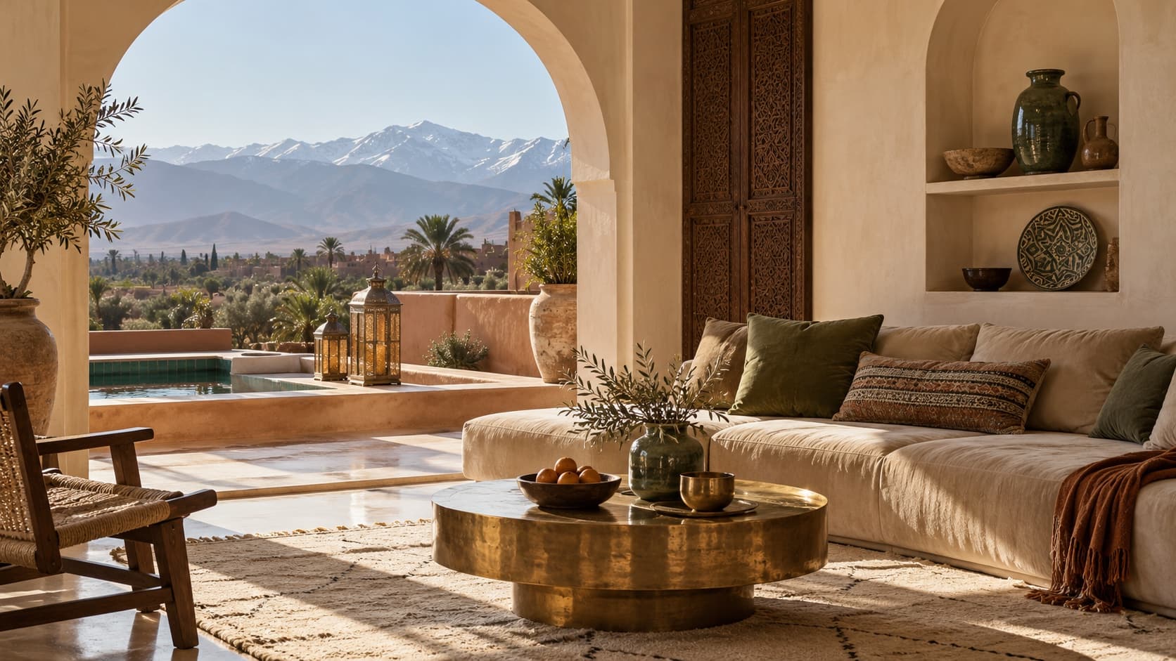 Sand velvet sofa and brass table beneath an open arch